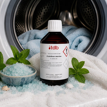 Flacon du booster Fraicheur marine avec sel marin et menthe devant un lave-linge